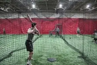 Student in his batting stance at Philadelphia Reds baseball training academy