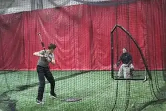 Student in his batting stance at Philadelphia Reds baseball training academy